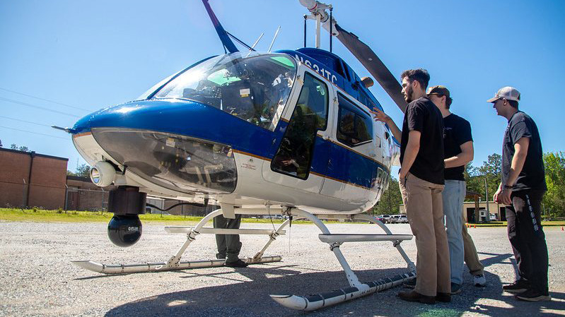 people viewing a helicopter at Transportation Awareness Day